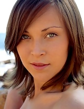 Cute Babe On A Rocky Shore